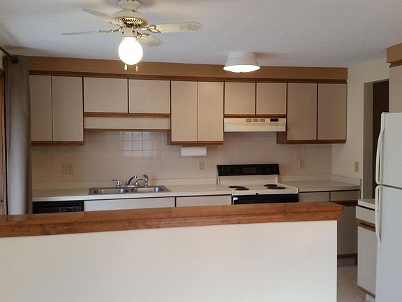 Kitchen with access to rear patio and garage