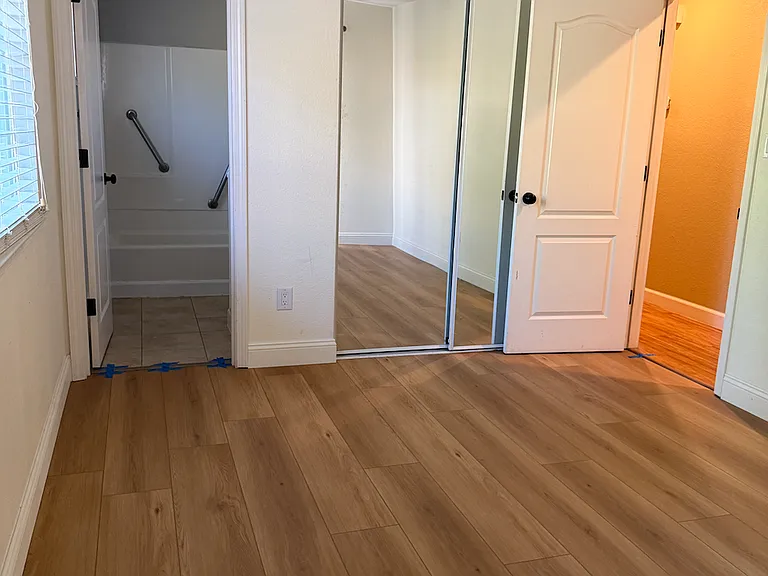 master bed with view of master bath