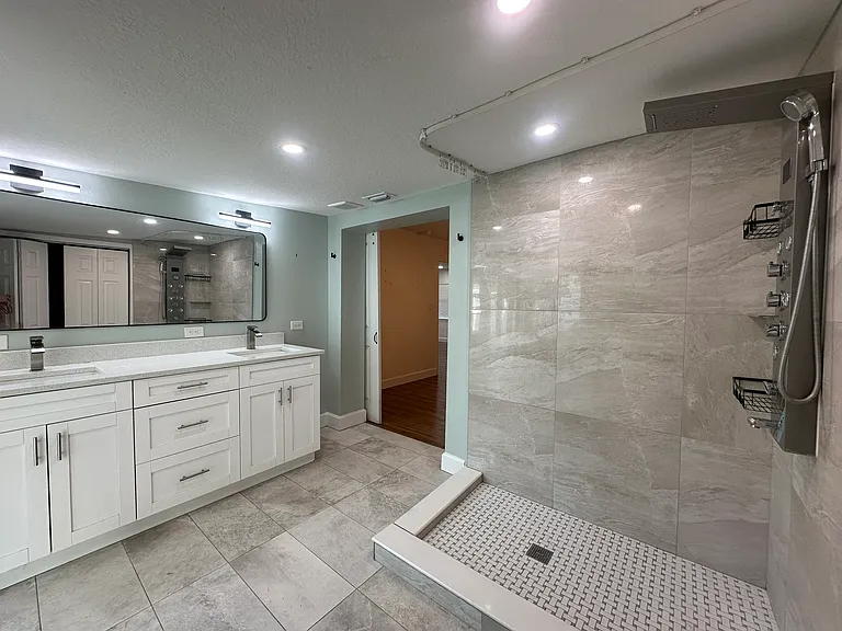 master bathroom spa shower and double vanity