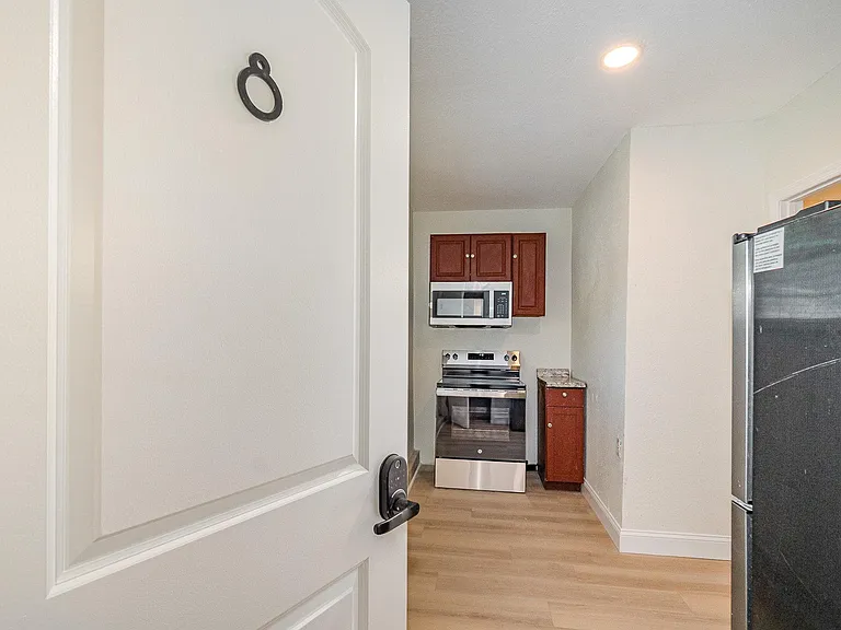 Room 8's full size stove, microwave, and ref