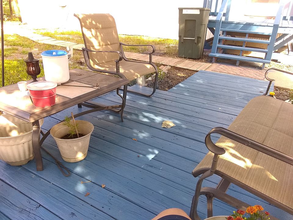 Patio in front under tree
