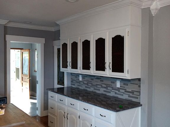 Plenty of kitchen cabinets with granite counters