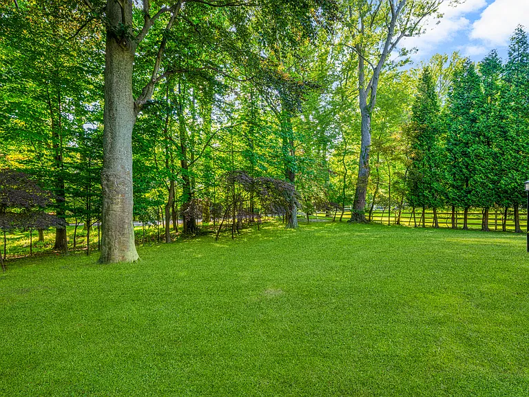 Gorgeous private yard with mature trees.