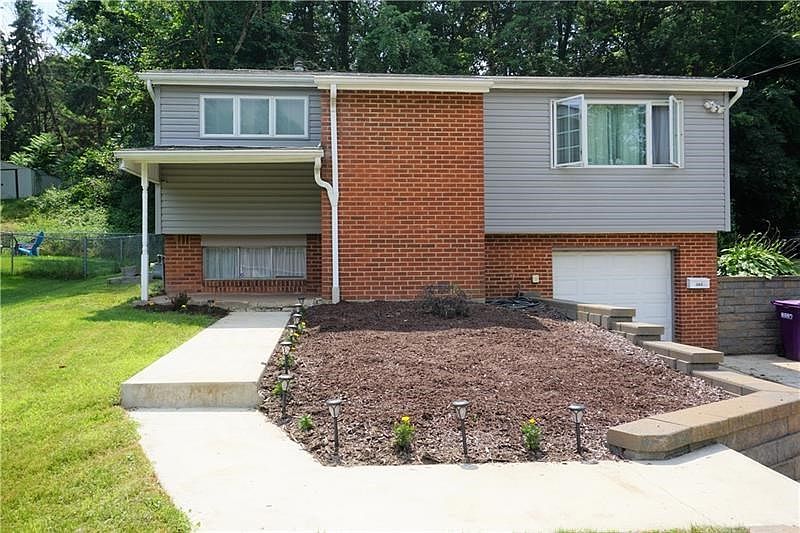 Beautiful Curb Appeal. Extra wide driveway to allow several off street parking, attractive steps and walk way, updated versa-lok