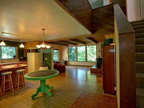 Open kitchen/dining area welcomes you into this warm, friendly home.