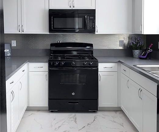 Beautiful marble look floors add to this wonderful contemporary home.