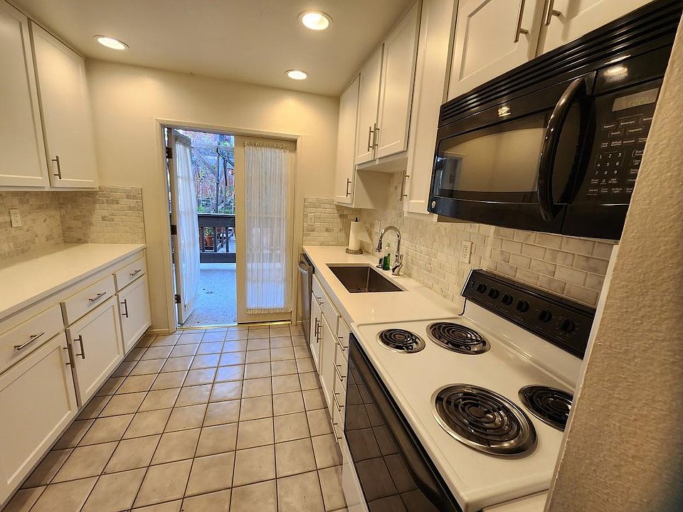 New Kitchen with new quartz countertops, new marble backsplash and new sink