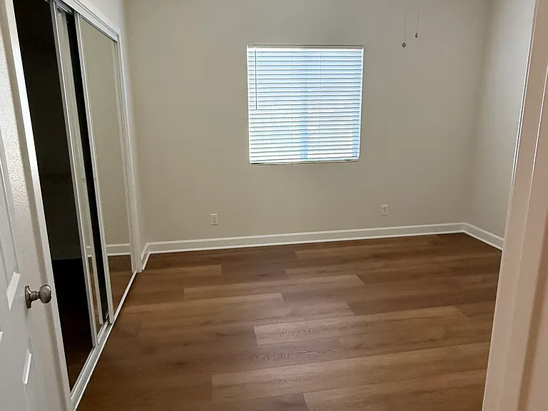 Bedroom upstairs with laminate wood flooring