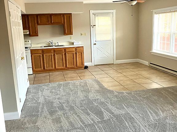 Open-concept living room/dining/kitchen