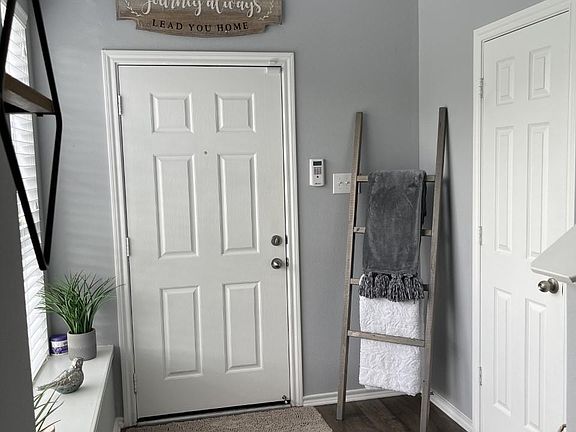 Entry way with half bath downstairs.
