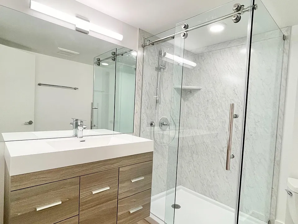 New bathroom with custom shower and solid surface top vanity
