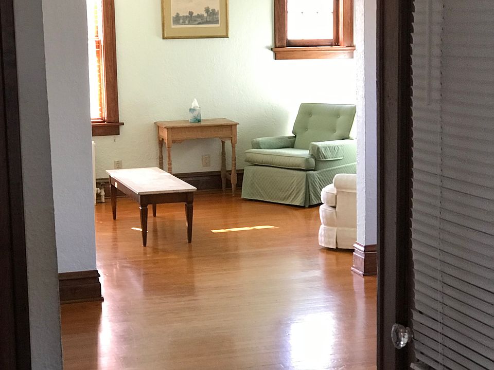 Into living room from dining room. 
no furniture.