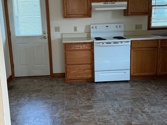 Kitchen side door to trash cans