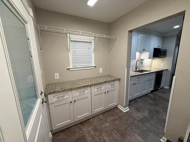 laundry room; door to left is a barn door visable from opposite side