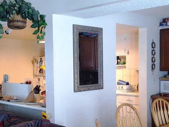 Looking toward kitchen, half bath and laundry hook ups