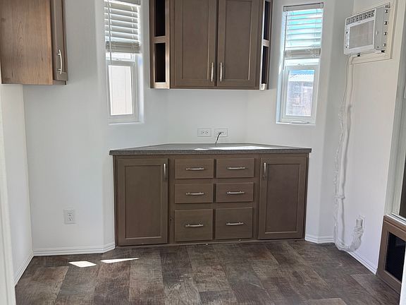 Bedroom with lots of drawers and cabinet space closet with mirror doors