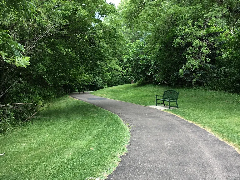 Paved walking trail around Otten Pond directly adjacent to C