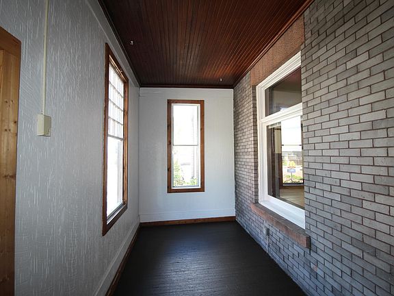 Enclosed front porch.