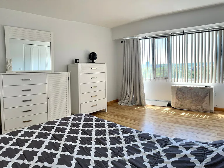 Large windows, south facing for a sunny bedroom. Same gorgeous views as balcony.