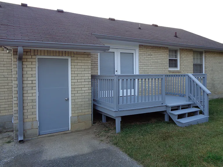 Back of house with deck.