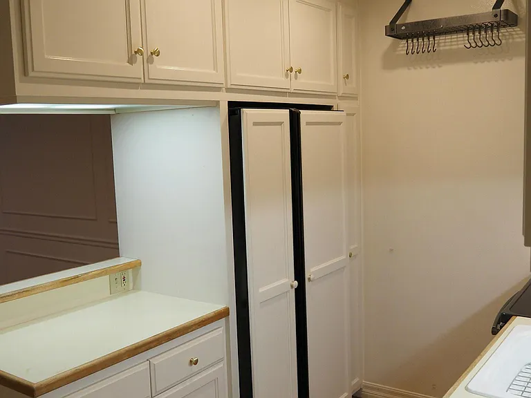 Fully-equipped modern kitchen. New refrigerator and range. Pan rack and recessed lighting