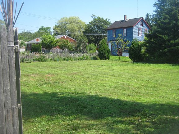 Unusual for the heart of Newport, house has an open field backyard for grilling and relaxing