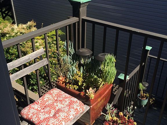 Balcony, sitting area and stairs to yard