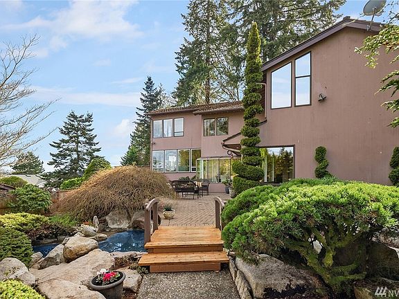 Entry Bridge Over Ponds to Brick Paver Patio