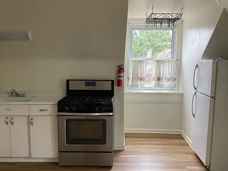 Beautiful eat-in-kitchen with pantry, appliances and microwave.