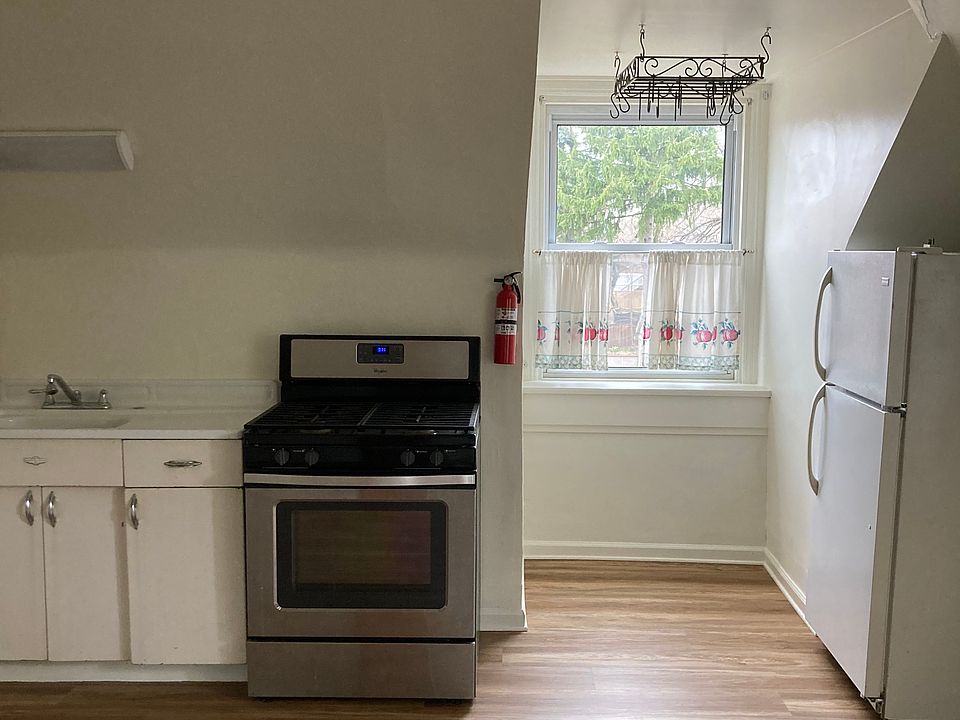Beautiful eat-in-kitchen with pantry, appliances and microwave.