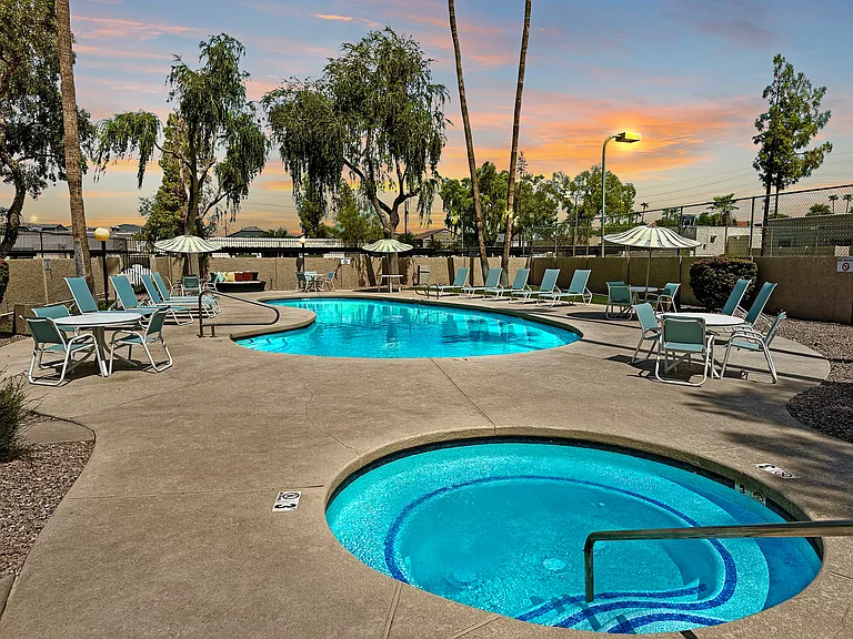 Enjoy the COMMUNITY POOL and HOT TUB with JETS, along with new pool furniture and tables for your comfort and relaxation!