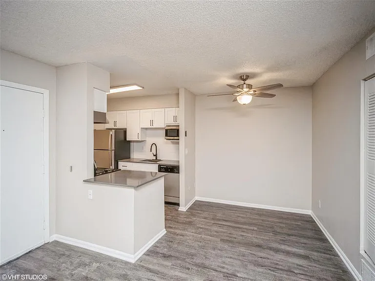 Open dining and living space with overhead light