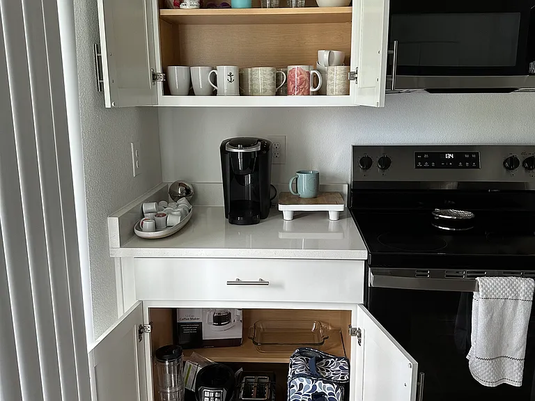 overstocked kitchen with beach and and things for outings in kitchen and storage unit