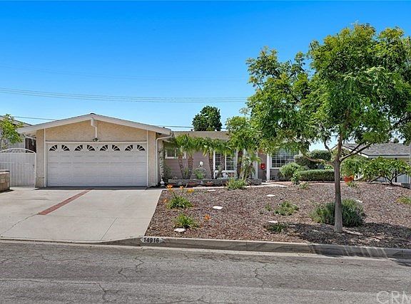 2 car garage with roll up door and wide driveway