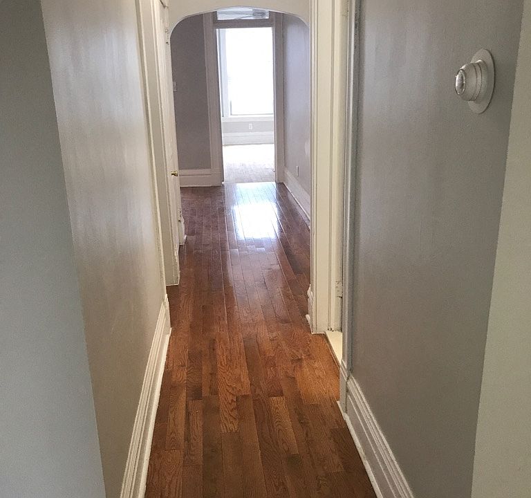 Hallway - Gray Turnover & Hardwood Floor