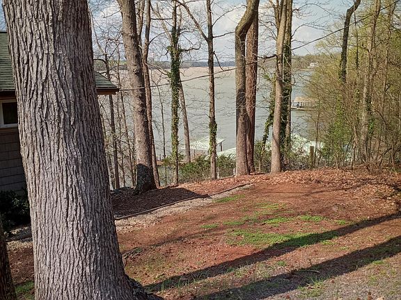 The house is surrounded by trees and views of Lake Wylie