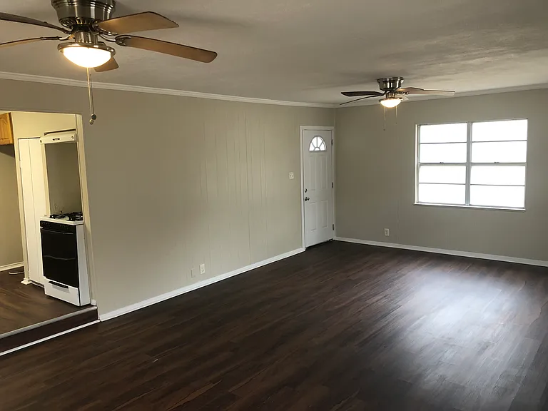 Large living/dining area with new luxury vinyl plank flooring.