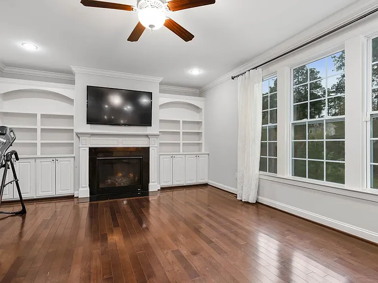 family room with wooded view