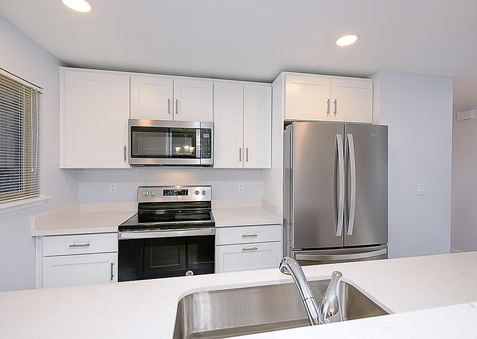 Brand new stainless steel appliances include; fridge, stove, garbage disposal, microwave and new cabinetry and hardware.