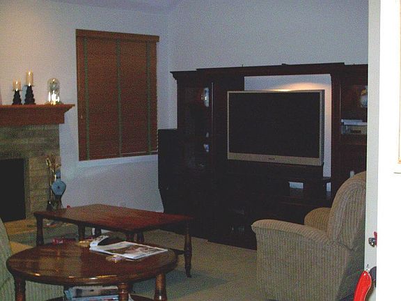 family room with vaulted ceiling