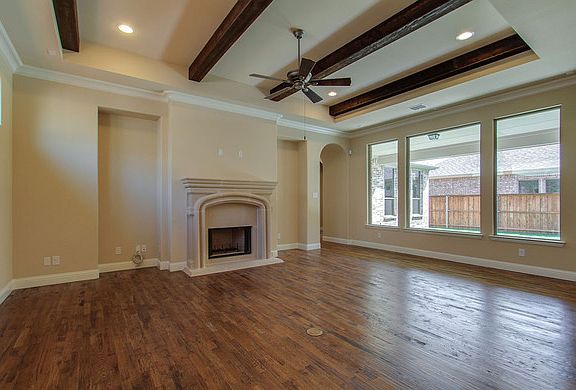 Beamed ceiling and built-in shelves in the Family Room