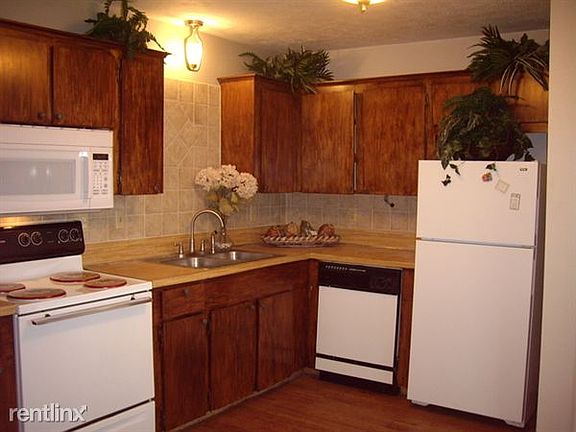 kitchen with Tile Back Splash and recent appliances, built i