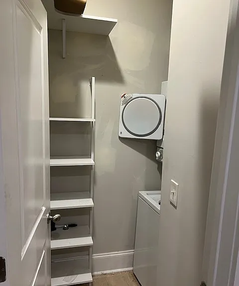 washer/dryer combo with extra storage shelving unit