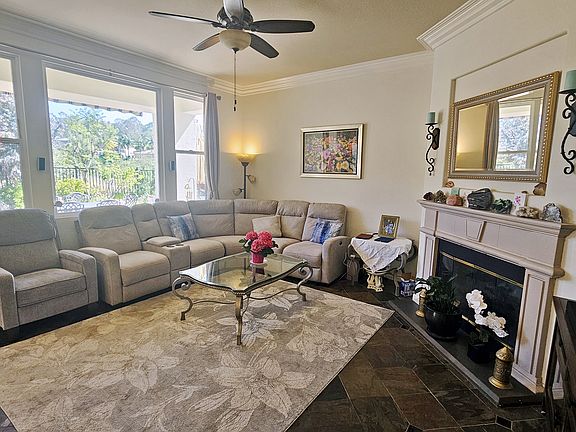 Family room next to kitchen. Sofa is new with 3 motorized reclining seats.