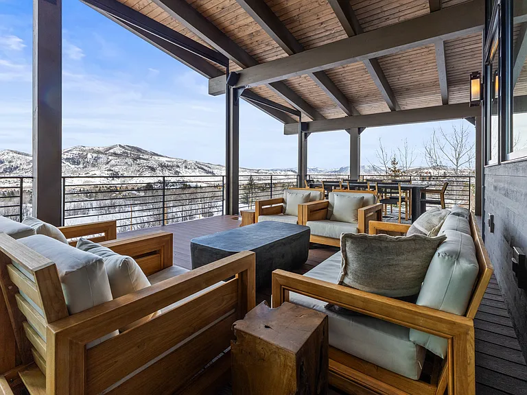 Main Level Wraparound Covered Deck with a view