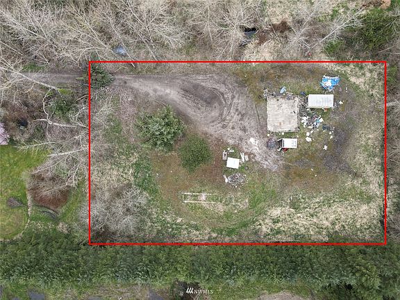 Nice size flat lot with water and power. Needs septic system. Existing system does not pass Pierce County Health Department standards. Debris in process of being cleaned up. >