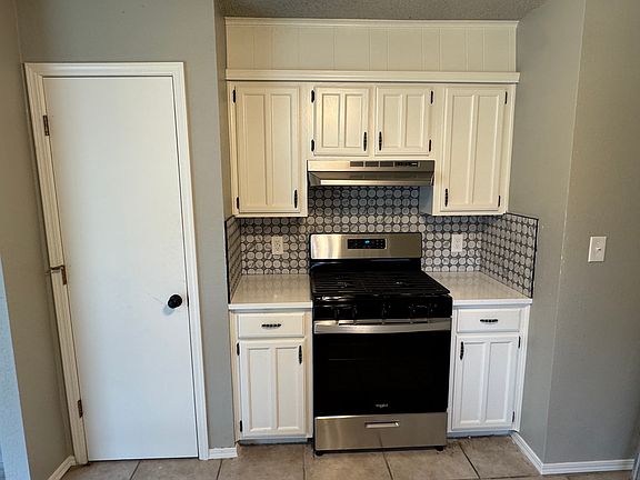 Kitchen with new oven/range.