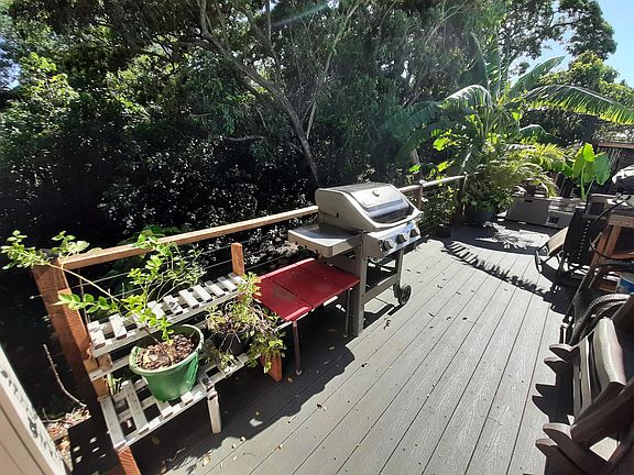 Backyard deck space overlooking a babbling brook