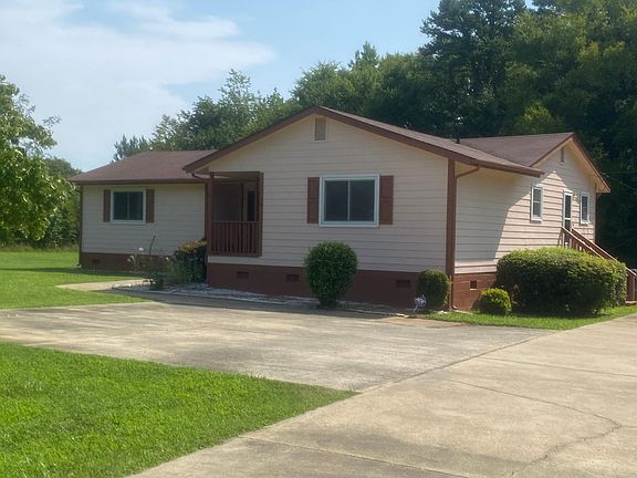 Front of House showing uncovered parking