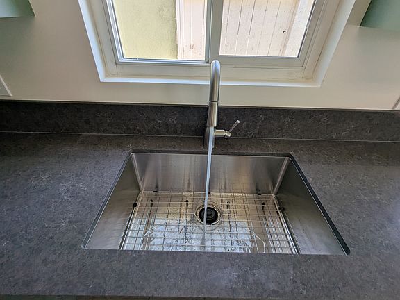 Newly renovated kitchen with Babylon gray countertops